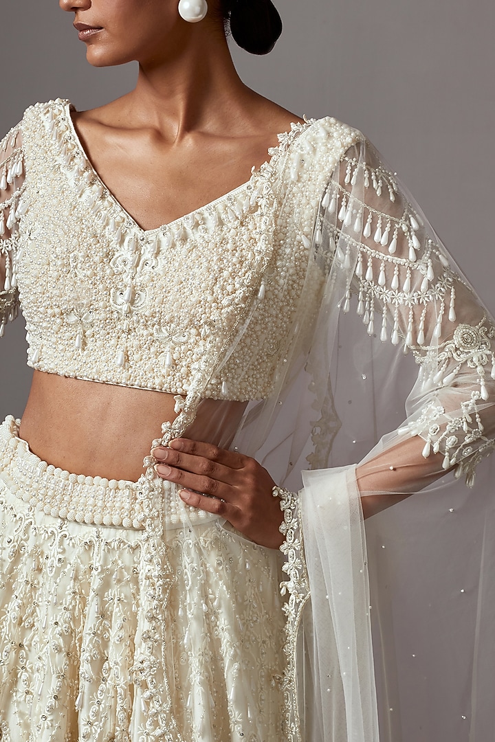 Ivory Net Pearl Embroidered Bridal Lehenga Set by Mala and Kinnary at Pernia's Pop Up Shop