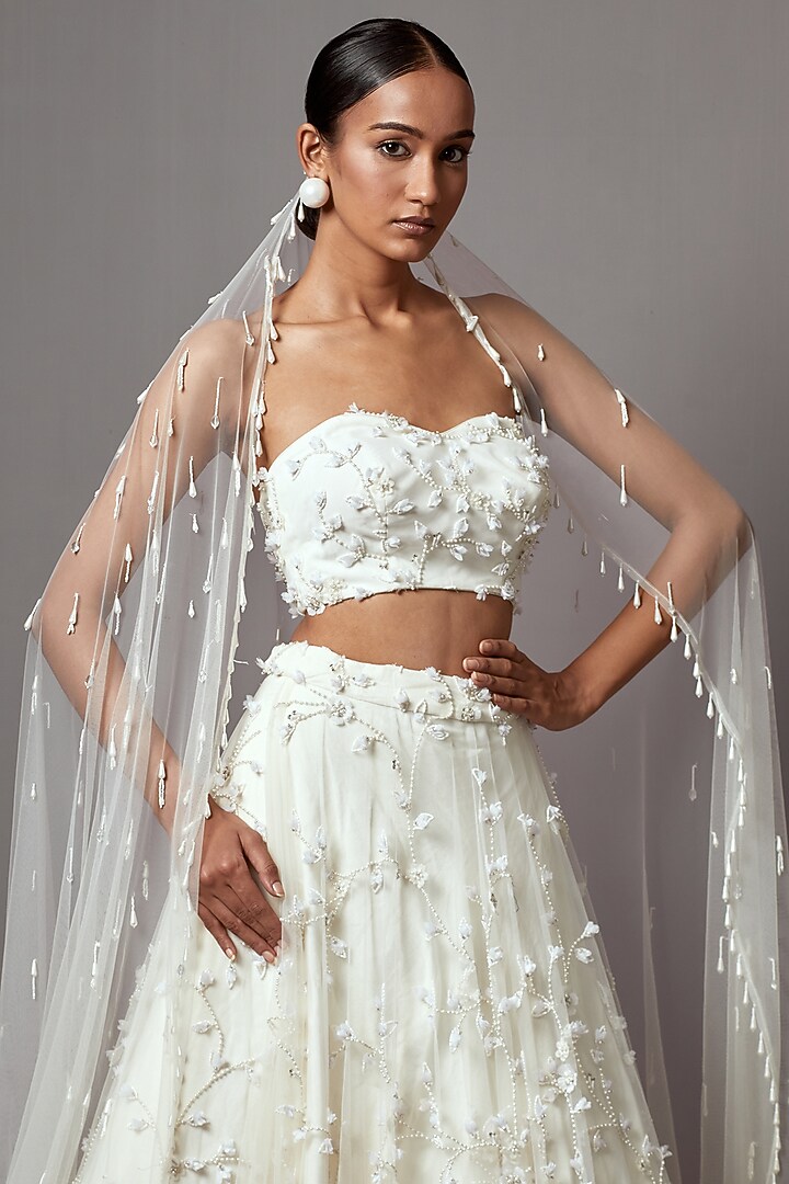Ivory Net Hand Embroidered Bridal Lehenga Set by Mala and Kinnary at Pernia's Pop Up Shop