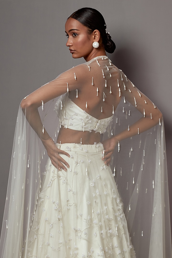 Ivory Net Hand Embroidered Bridal Lehenga Set by Mala and Kinnary at Pernia's Pop Up Shop
