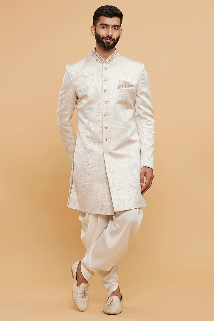 Cream Brocade Thread Embroidered Wedding Sherwani Set by Twamev at Pernia's Pop Up Shop