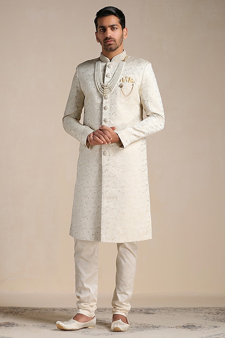 Beige Brocade Paisley Self-Textured Sherwani Set by Manyavar