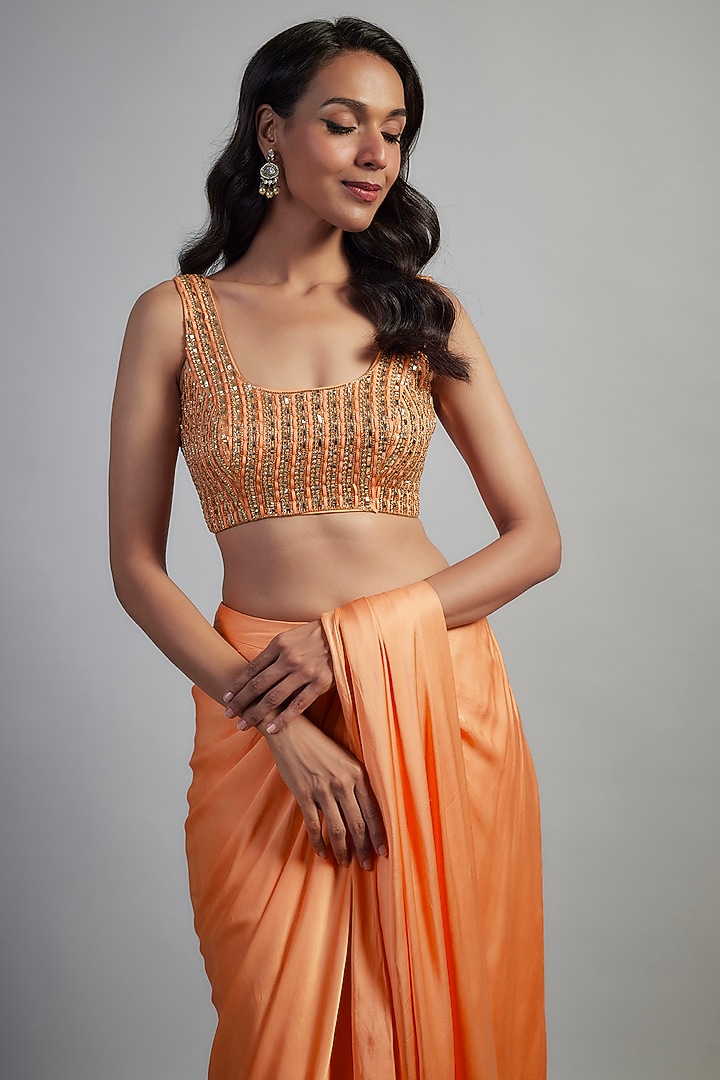 Peach Modal Satin Cutdana Hand Embroidered Layered Skirt Party Wear Saree Set by Mahek Rohra at Pernia's Pop Up Shop