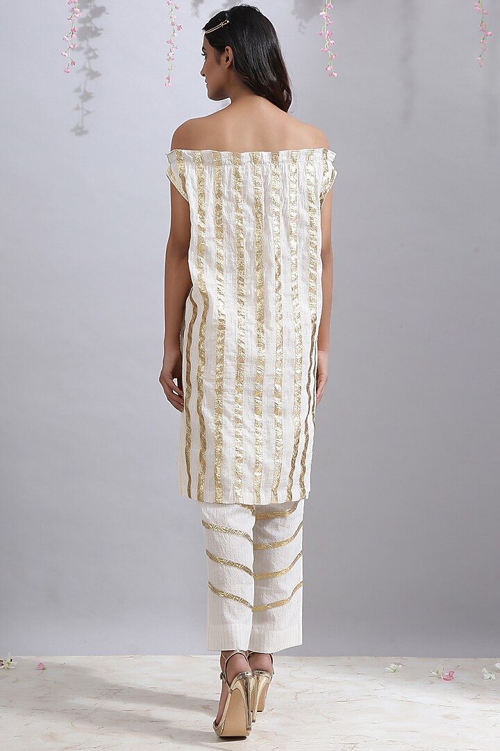 Ivory Gota Striped Off-Shoulder Tunic by Maison Shefali at Pernia's Pop Up Shop
