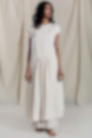 Beige Pleated & Flared Shift Dress by Mati at Pernia's Pop Up Shop