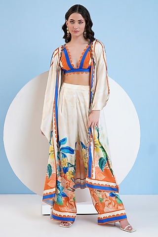 Ivory Satin Floral Printed Cape Set by Mandira Wirk - Resort