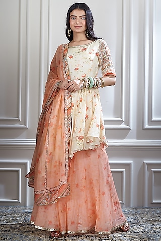 Ivory & Orange Printed Asymmetric Kurta Set by Mandira Wirk - Indian