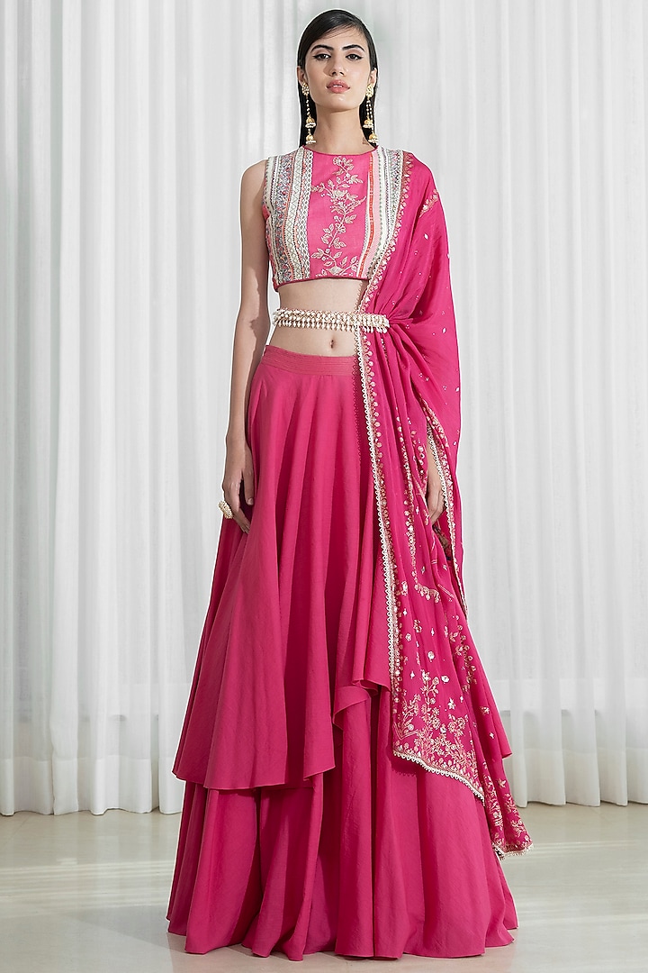 Fuchsia Printed Layered Lehenga Set by Mandira Wirk