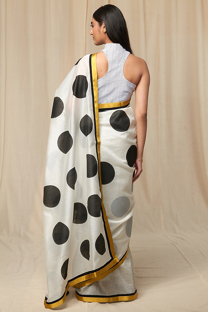 Black and white polka dot saree with an ivory blouse available only at Pernia's Pop Up Shop.