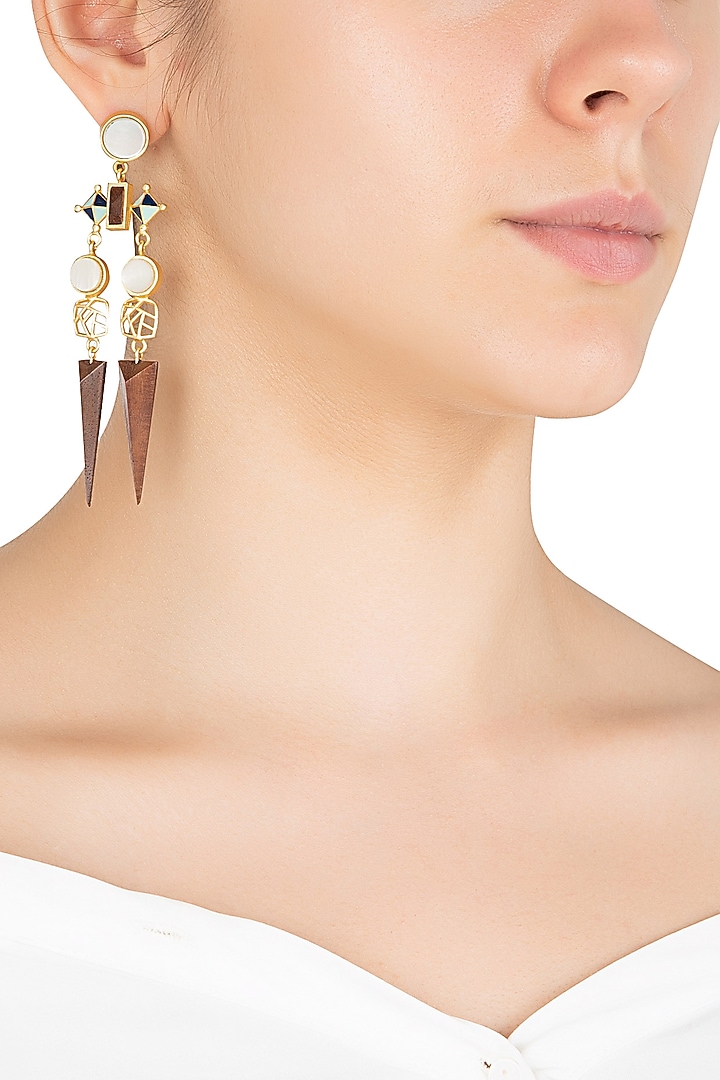 Gold plated 3D cut mother of pearl earrings available only at Pernia's Pop Up Shop.