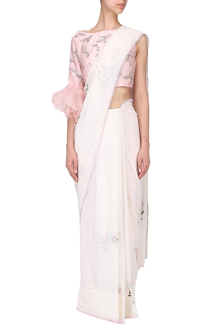 Ivory embroidered saree with pink blouse set available only at Pernia's Pop Up Shop.