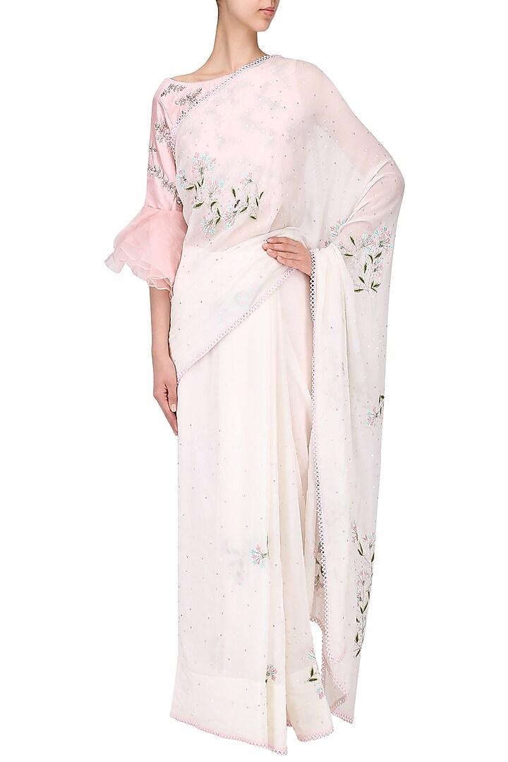 Ivory embroidered saree with pink blouse set available only at Pernia's Pop Up Shop.
