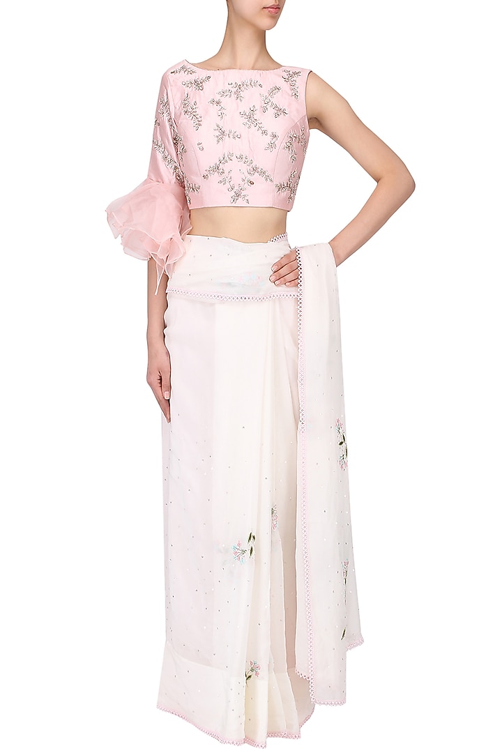 Ivory embroidered saree with pink blouse set available only at Pernia's Pop Up Shop.
