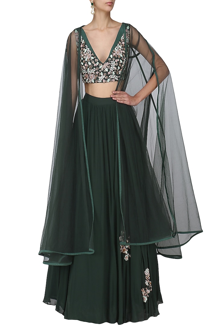 Dark green embroidered lehenga with cape set available only at Pernia's Pop Up Shop.
