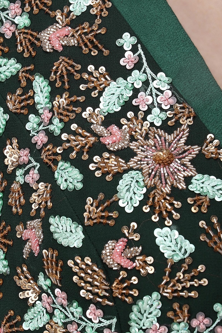 Dark green embroidered lehenga with cape set available only at Pernia's Pop Up Shop.