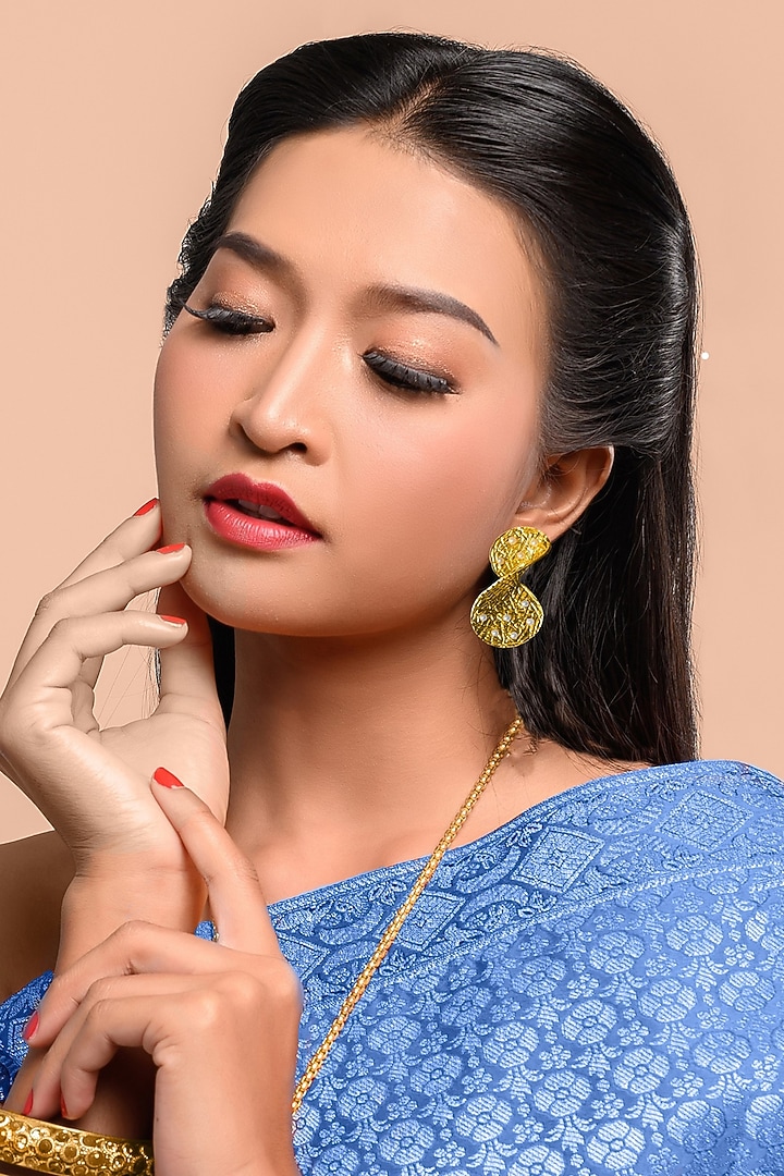 Gold Finish Pearl Twisted Stud Earrings by MEDOSO JEWELLERY at Pernia's Pop Up Shop