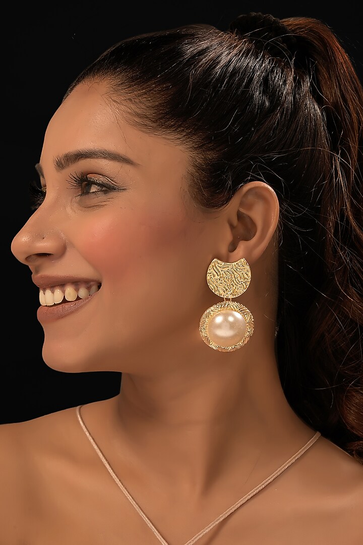 Gold Finish Pearl Dangler Earrings by MEDOSO JEWELLERY at Pernia's Pop Up Shop