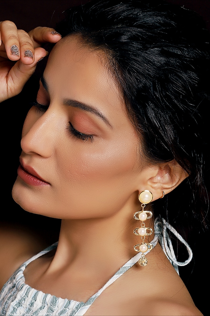 Gold Finish Pearl Textured Dangler Earrings by MEDOSO JEWELLERY at Pernia's Pop Up Shop