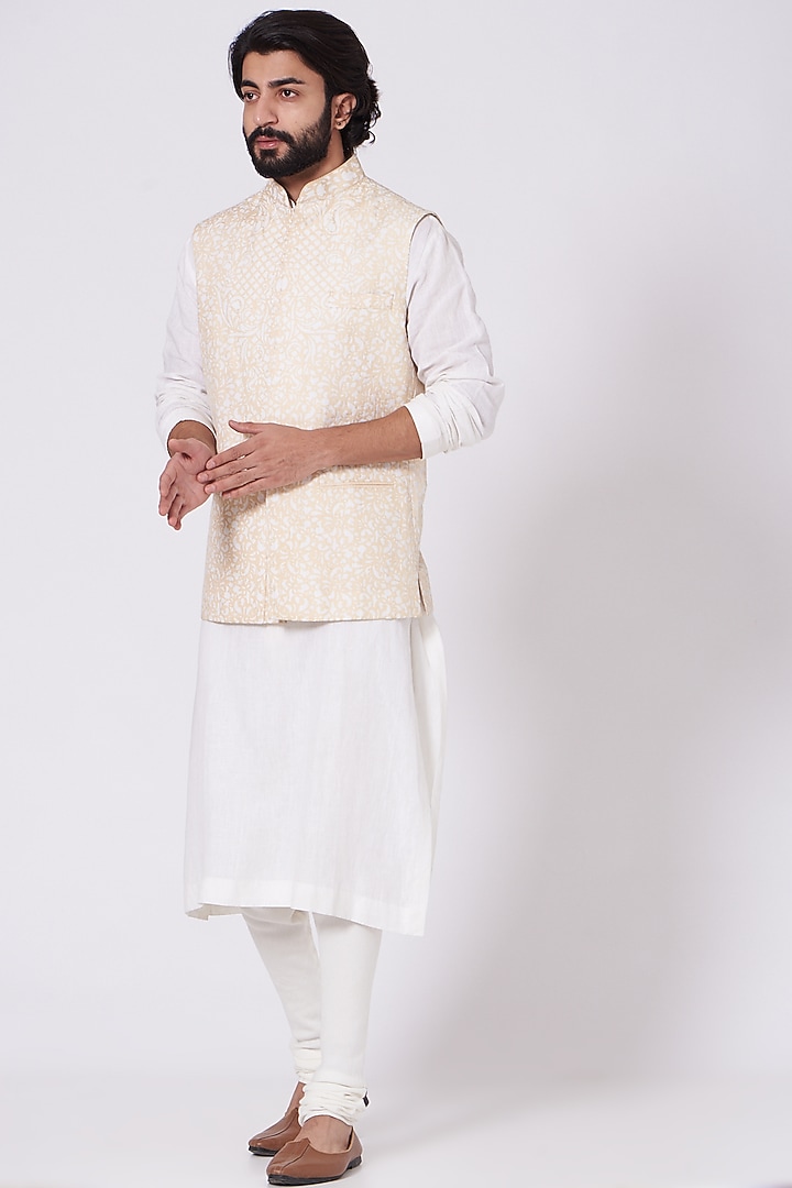 Ivory Kurta Set With Beige Bundi Jacket by Mehraab Men at Pernia's Pop Up Shop