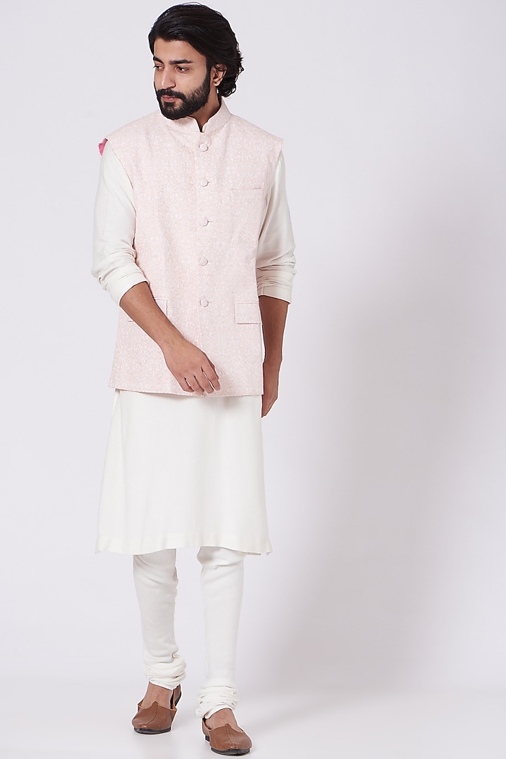 Pastel Pink Embroidered Bundi Jacket by Mehraab Men