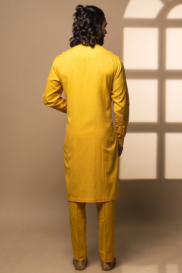 Yellow Khadi Asymmetrical Kurta Set by Medhavini Khaitan at Pernia's Pop Up Shop