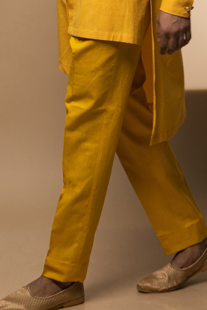 Yellow Khadi Asymmetrical Kurta Set by Medhavini Khaitan at Pernia's Pop Up Shop