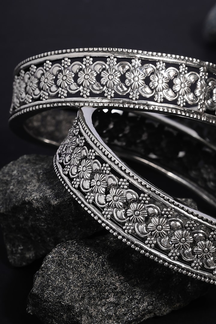 White Finish Floral Temple Bangles In Sterling Silver (Set Of 2) by Mero at Pernia's Pop Up Shop
