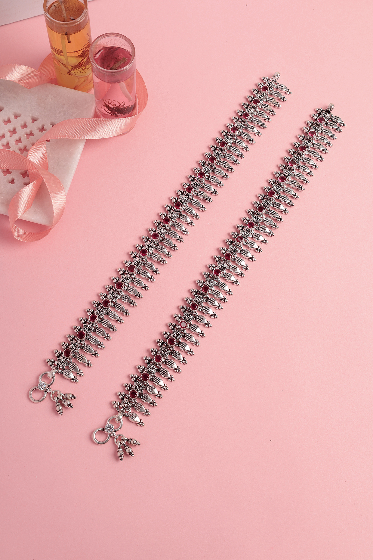 White Finish Ruby Stone Temple Spoke Anklets In Sterling Silver (Set Of 2) by Mero at Pernia's Pop Up Shop