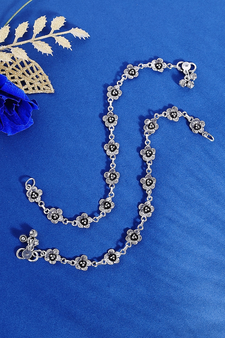 White Finish Floral Temple Anklets In Sterling Silver (Set Of 2) by Mero at Pernia's Pop Up Shop