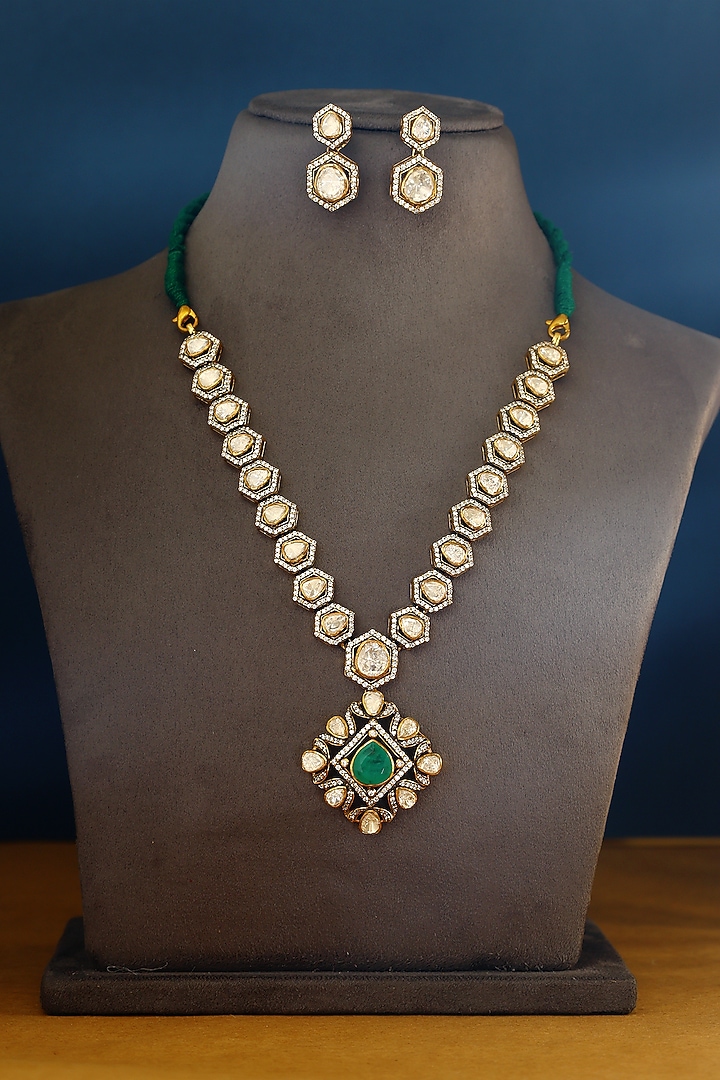 Gold Finish Moissanite & Emerald Temple Necklace Set In Sterling Silver by Mero at Pernia's Pop Up Shop