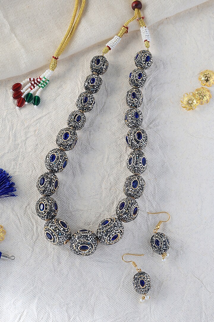 White Finish Sapphire Stone Temple Necklace In Sterling Silver by Mero at Pernia's Pop Up Shop