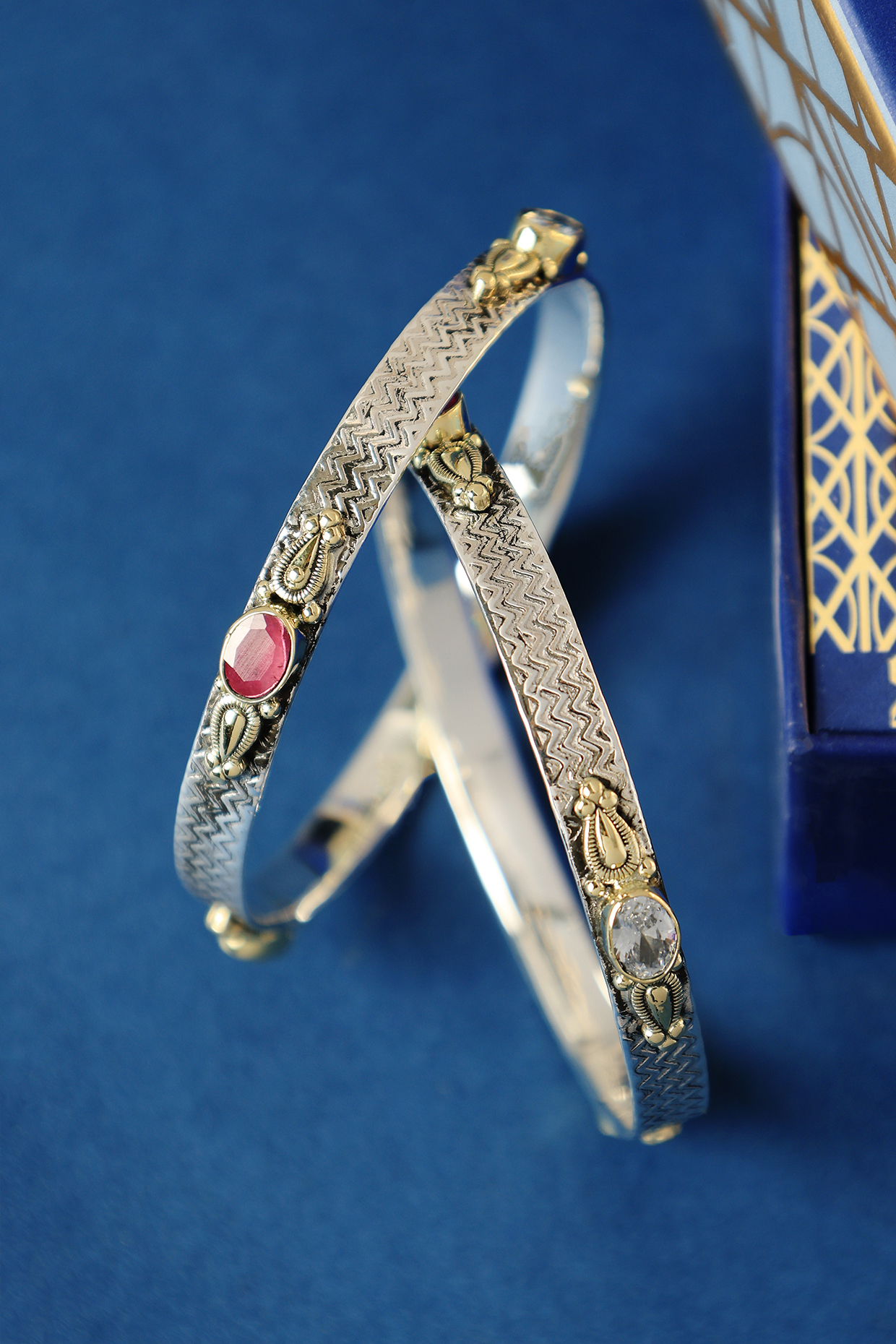 Two Tone Finish Ruby Onyx & CZ Temple Bangles In Sterling Silver (Set Of 2) by Mero at Pernia's Pop Up Shop