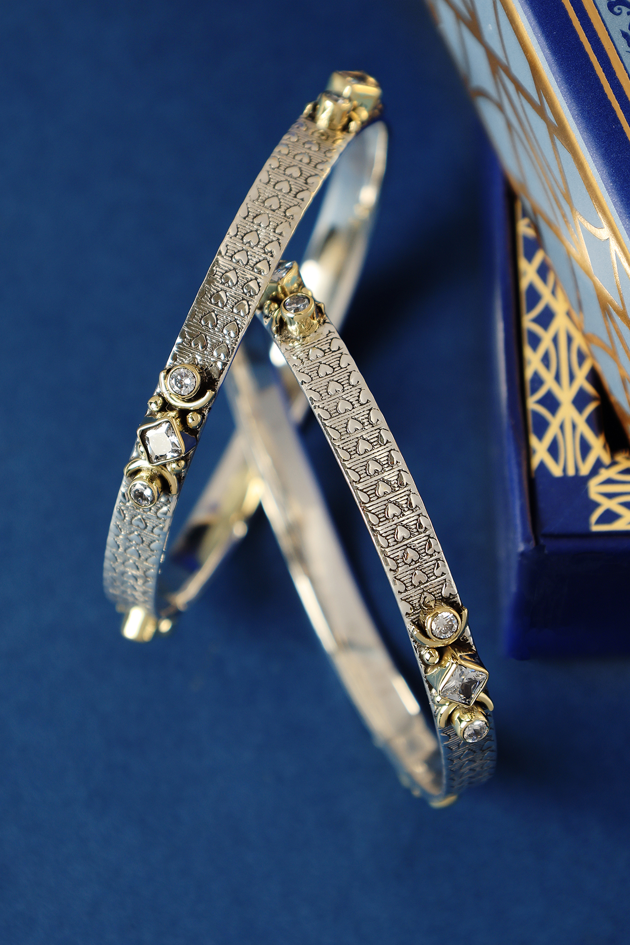 Two Tone Finish CZ Temple Bangles In Sterling Silver (Set Of 2) by Mero at Pernia's Pop Up Shop