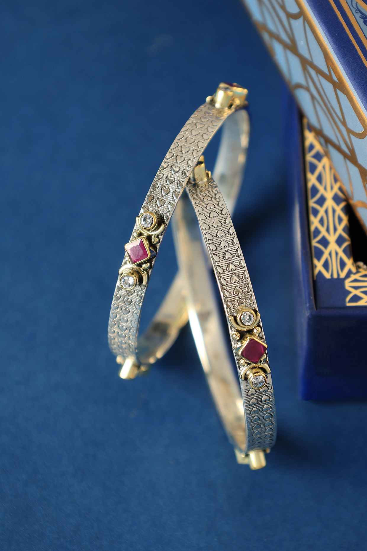 Two Tone Finish Ruby Onyx & CZ Temple Bangles In Sterling Silver (Set Of 2) by Mero at Pernia's Pop Up Shop