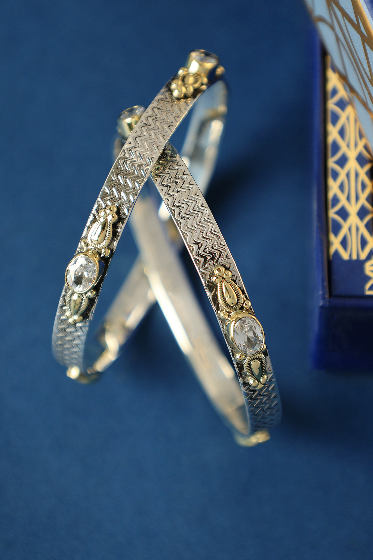Two Tone Finish CZ Temple Bangles In Sterling Silver (Set Of 2) by Mero at Pernia's Pop Up Shop