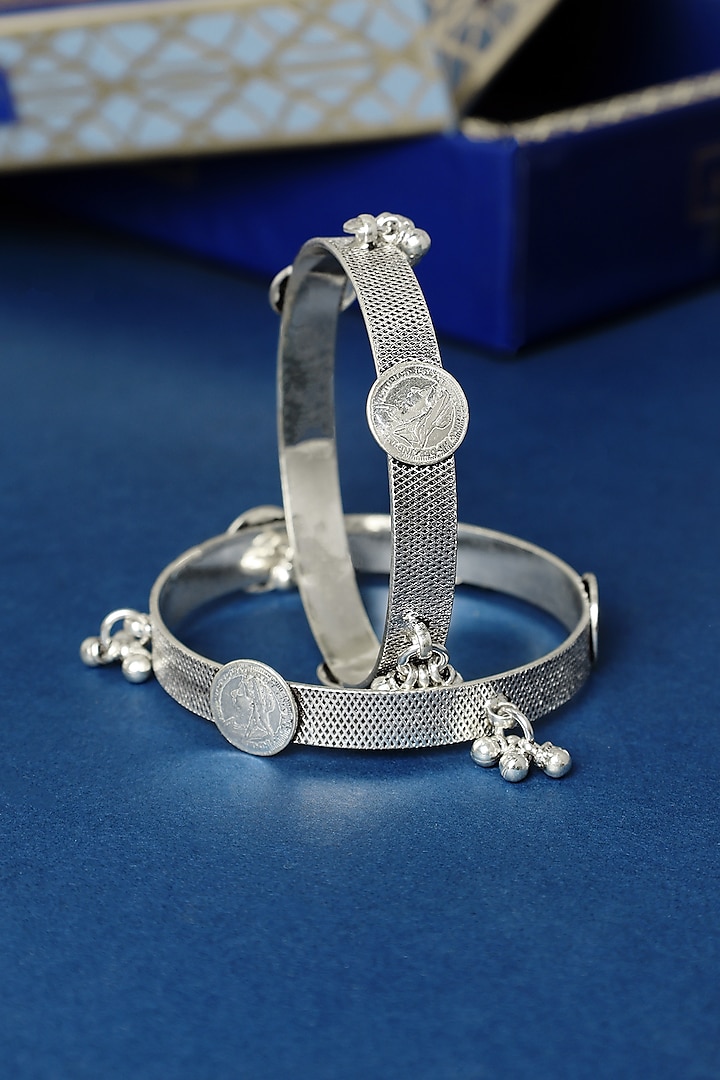 White Finish Ghungroo Temple Bangles In Sterling Silver (Set Of 2) by Mero at Pernia's Pop Up Shop