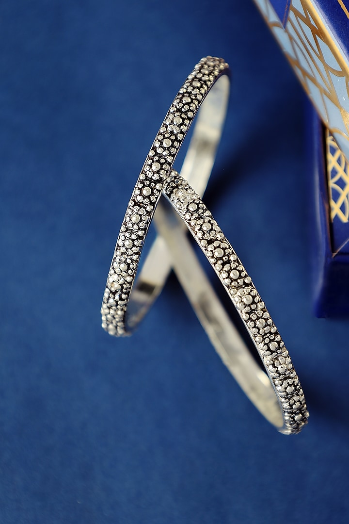 White Finish Temple Floral Bangles In Sterling Silver (Set Of 2) by Mero at Pernia's Pop Up Shop