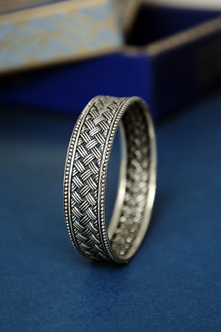 White Finish Temple Weaved Bangle In Sterling Silver by Mero at Pernia's Pop Up Shop