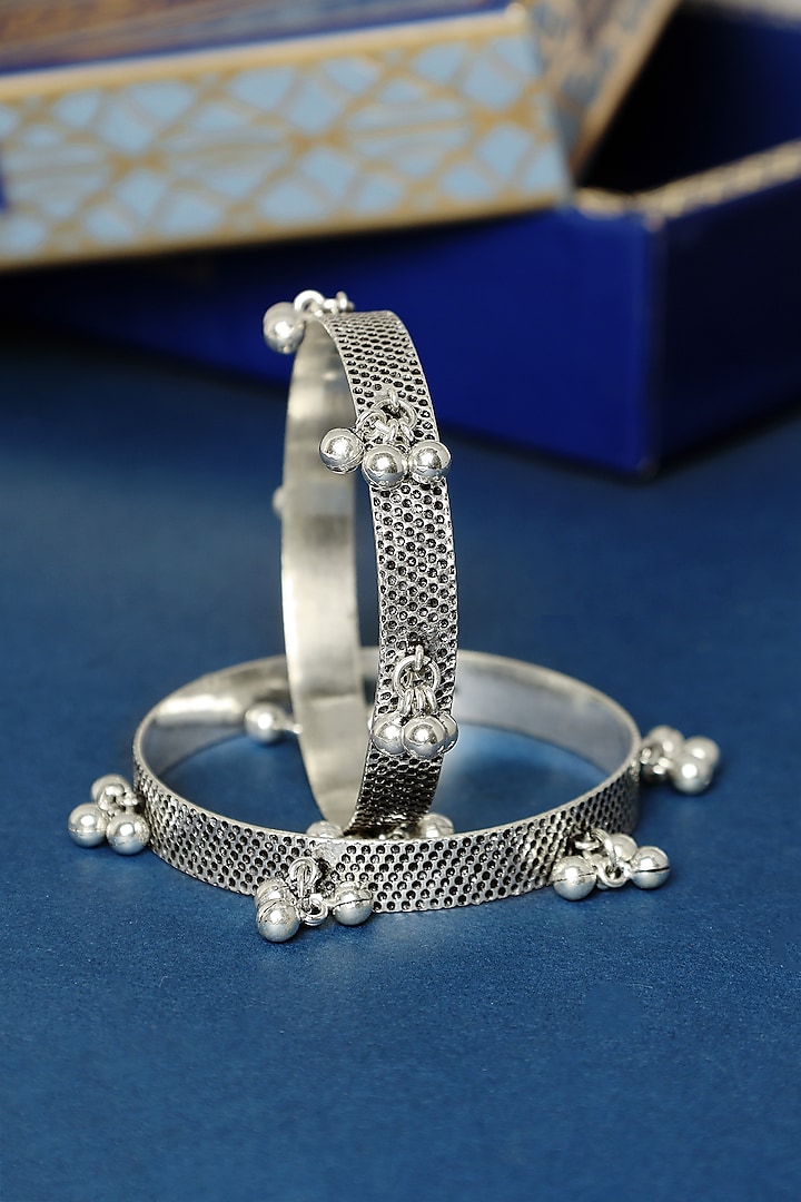 White Finish Temple Ghungroo Bangles In Sterling Silver (Set Of 2) by Mero at Pernia's Pop Up Shop