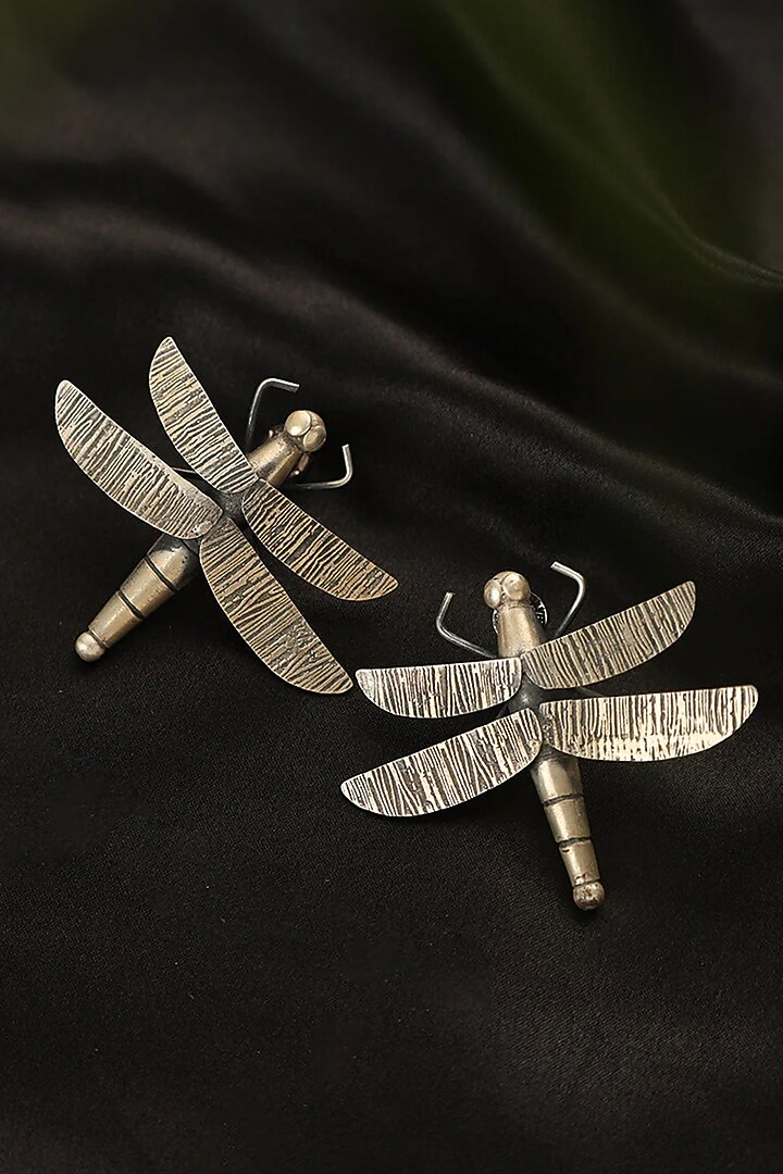 White Finish Fly Dangler Earrings In Sterling Silver by Mero at Pernia's Pop Up Shop