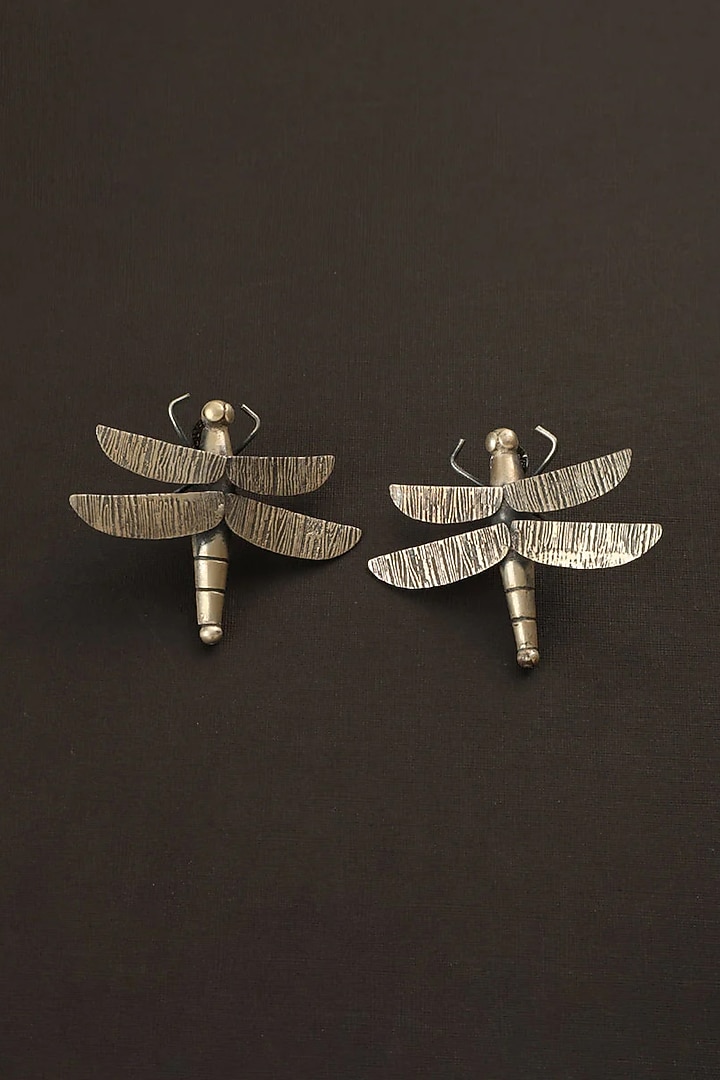 White Finish Fly Dangler Earrings In Sterling Silver by Mero at Pernia's Pop Up Shop