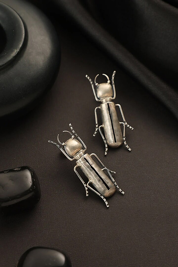 White Finish Bug Dangler Earrings In Sterling Silver by Mero at Pernia's Pop Up Shop