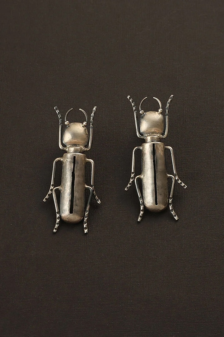 White Finish Bug Dangler Earrings In Sterling Silver by Mero at Pernia's Pop Up Shop