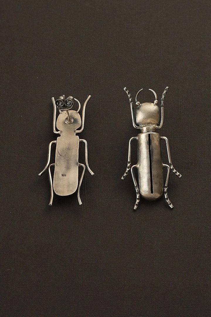 White Finish Bug Dangler Earrings In Sterling Silver by Mero at Pernia's Pop Up Shop