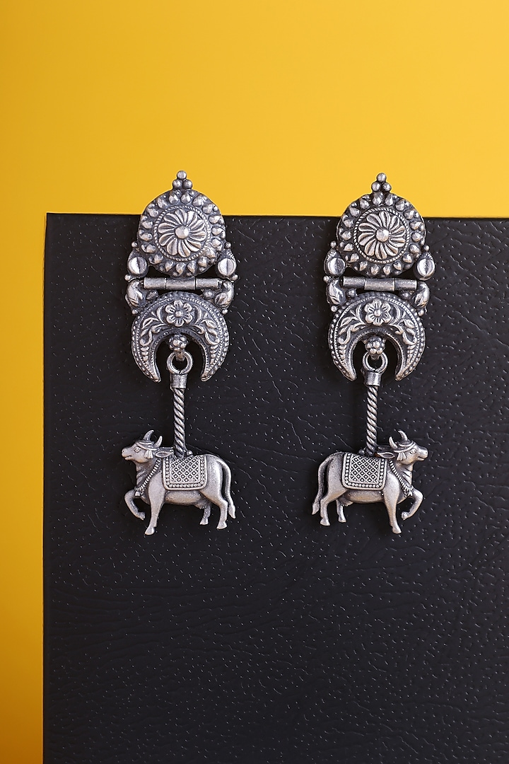 White Finish Kemp Stone Temple Cow Earrings In Sterling Silver by Mero at Pernia's Pop Up Shop