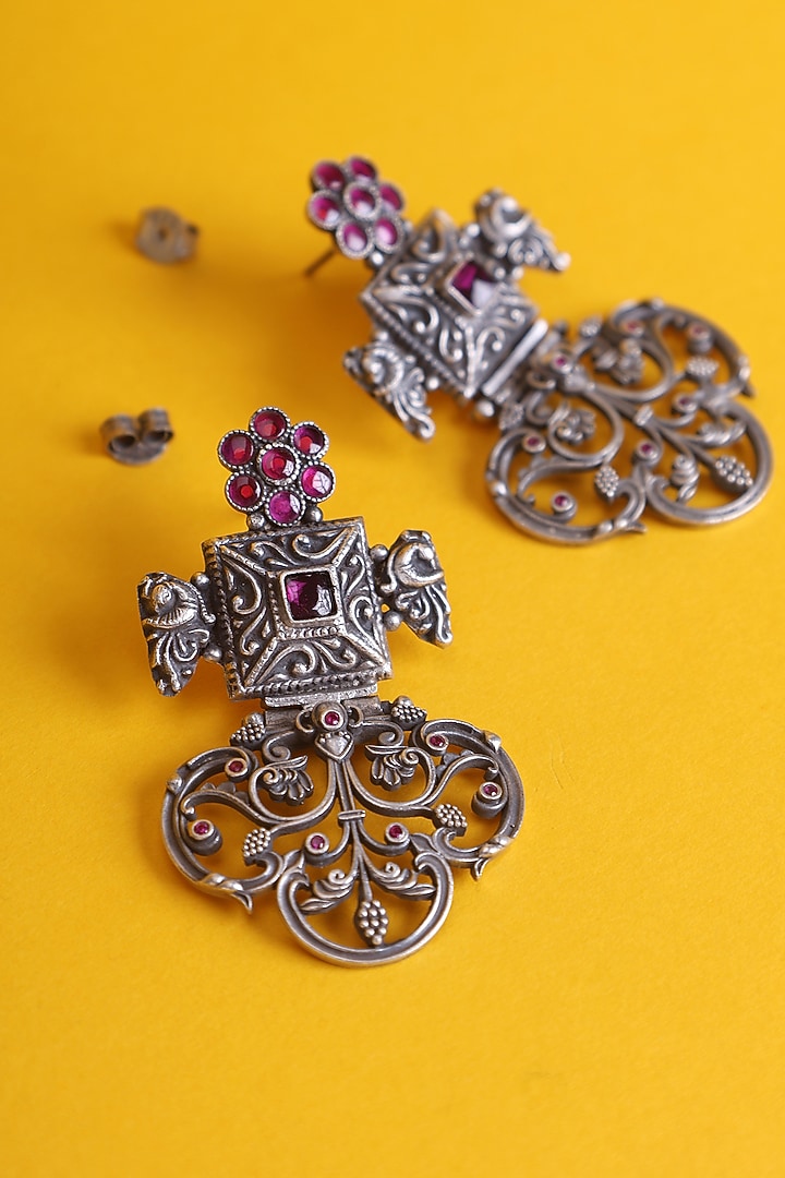 White Finish Carved Kemp Stone Temple Dangler Earrings In Sterling Silver by Mero at Pernia's Pop Up Shop