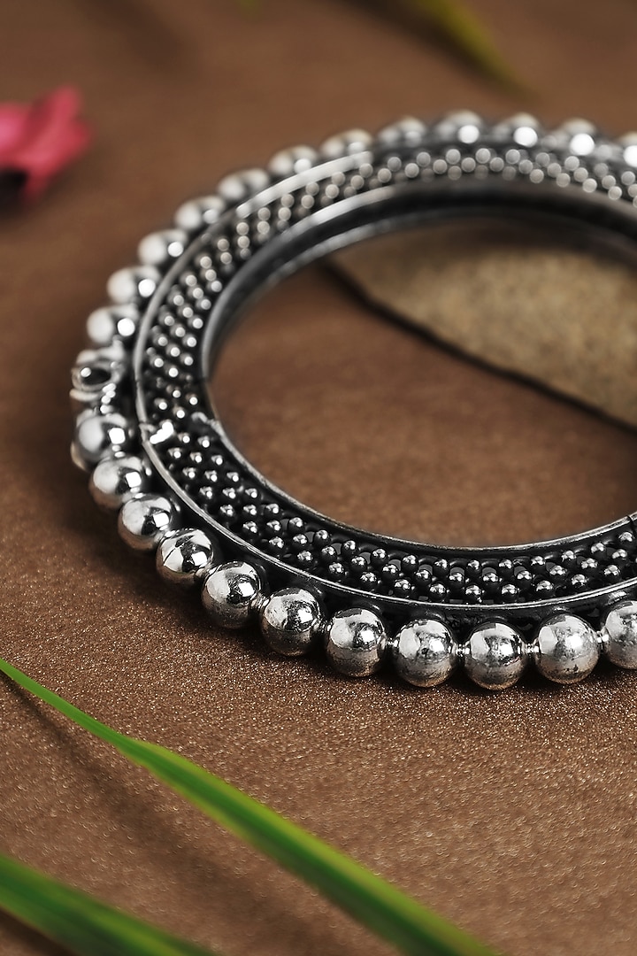 White Finish Textured Ball Temple Kada In Sterling Silver by Mero at Pernia's Pop Up Shop
