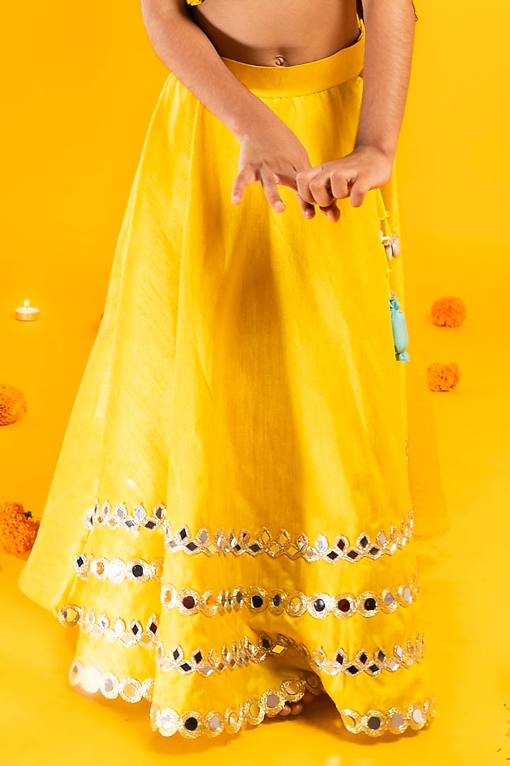 Mustard Yellow Cotton Silk Mirror Hand Embroidered Lehenga Set For Girls by Metaphor Kids at Pernia's Pop Up Shop