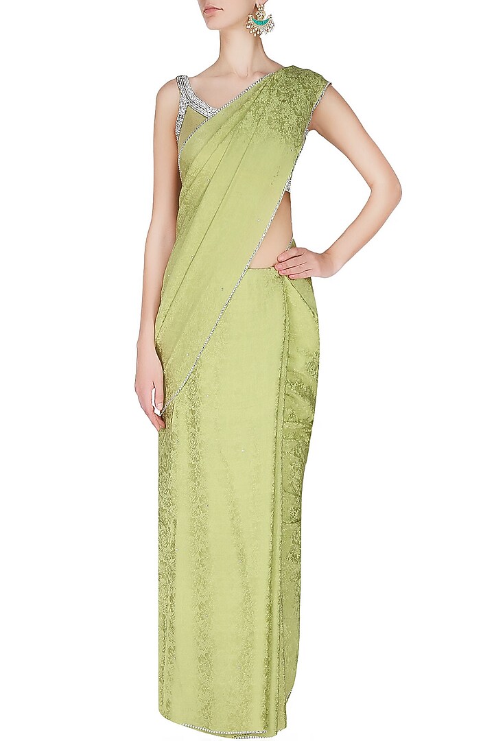 Manav Gangwani presents Olive green silver crystal line jacquard saree with matching olive green blouse available only at Pernia's Pop Up Shop.