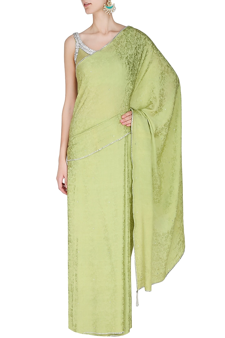 Manav Gangwani presents Olive green silver crystal line jacquard saree with matching olive green blouse available only at Pernia's Pop Up Shop.
