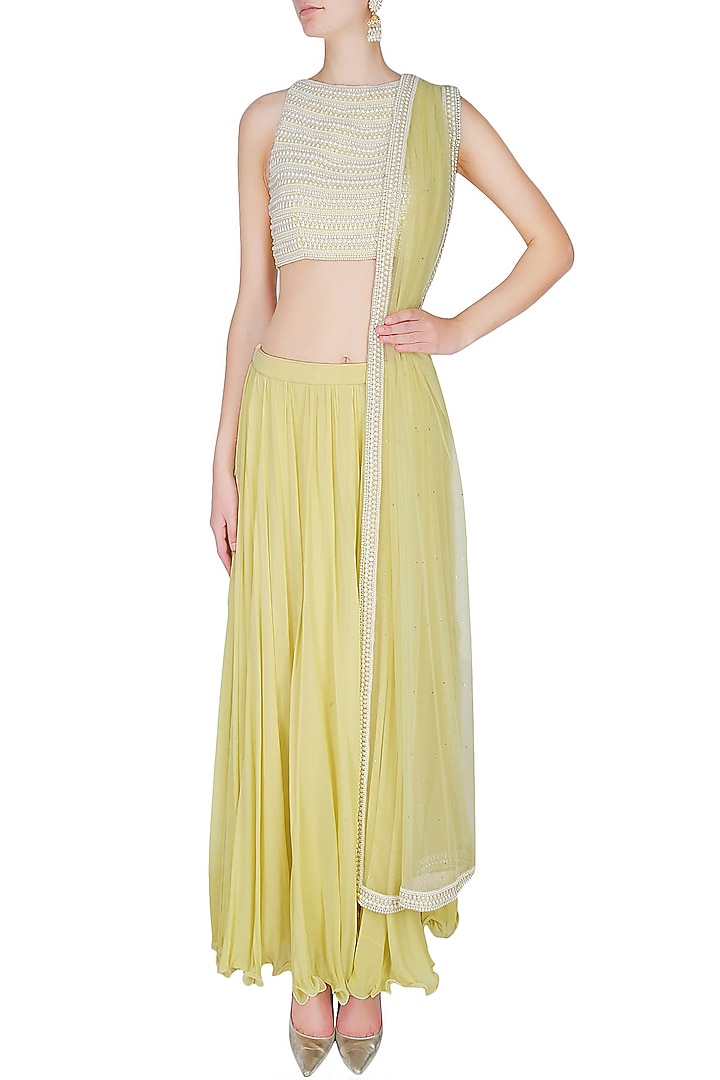 Manav Gangwani presents Lemon yellow pleated skirt with pearl embellished crop top blouse set available only at Pernia's Pop Up Shop.